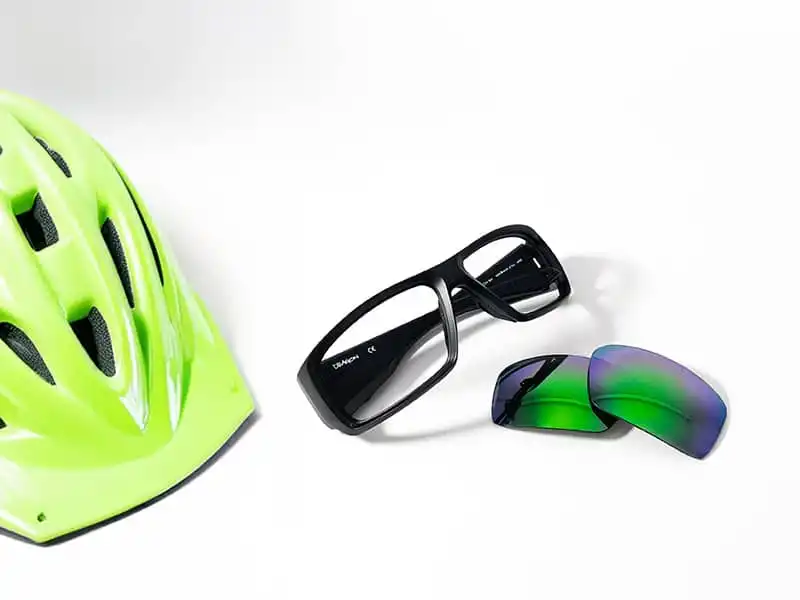 Close-up of cycling sunglasses lenses and helmet