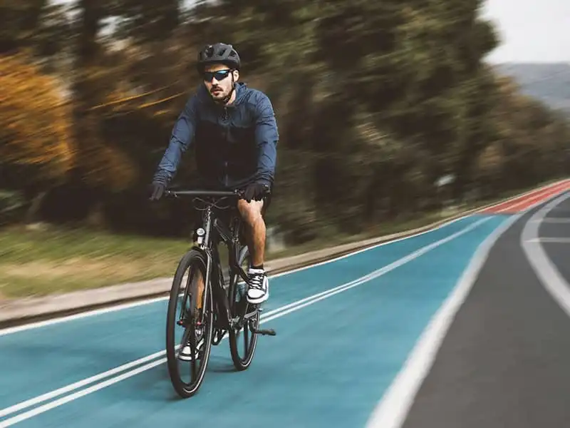 Cyclist wearing comfortable cycling sunglasses outdoors
