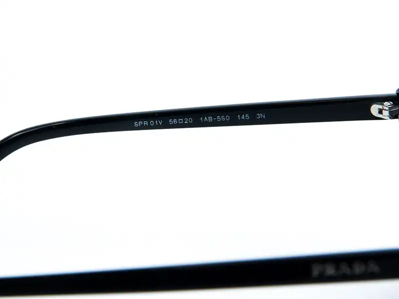 Inside arm of Prada sunglasses showing the model number, size, and color code—key identifiers for verifying authenticity
