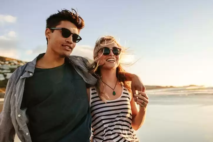 Couple wearing sunglasses in summer Couple wearing sunglasses in summer