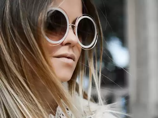 Woman wearing good designer sunglasses Woman wearing good designer sunglasses