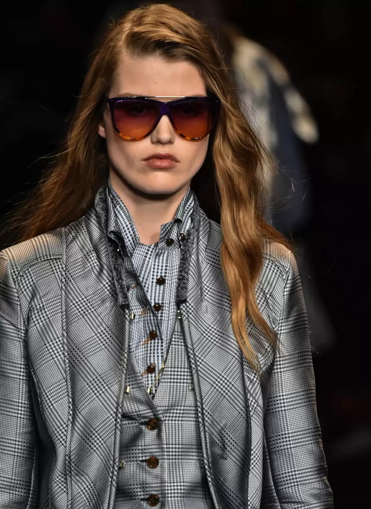 Designer Sunglasses model in grey suit Designer Sunglasses model in grey suit