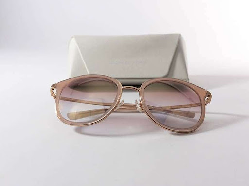 Rose designer sunglasses and white case