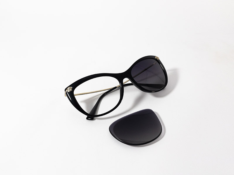 Black cat-eye sunglasses with a dark lens removed, displayed on a white background.