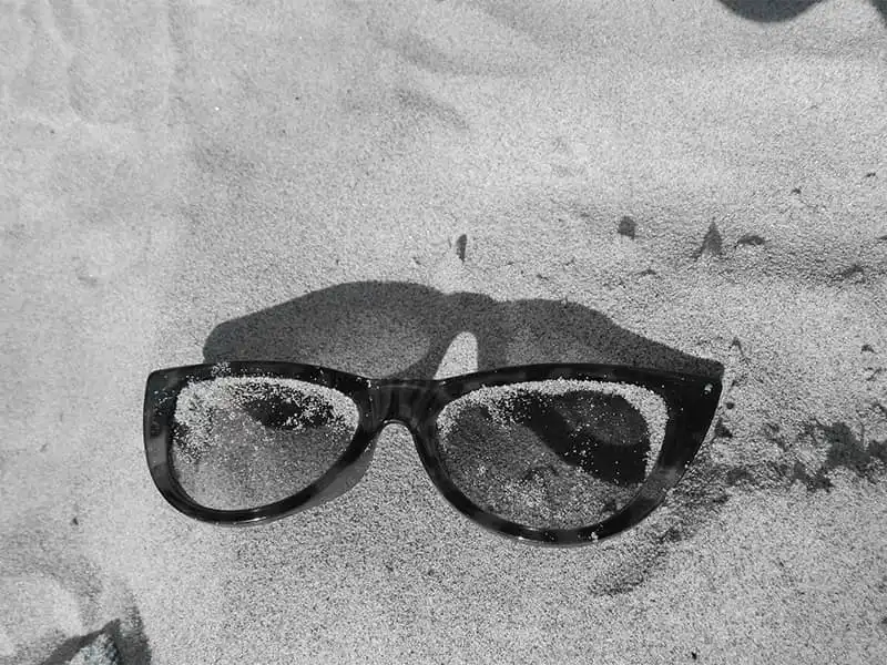 How to take care of your floating sunglasses on a sandy beach